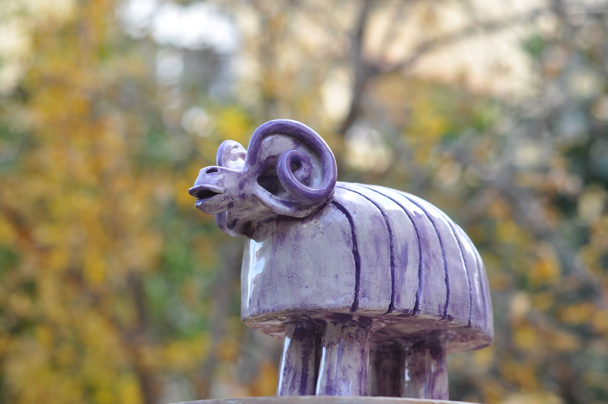 Purple ceramic ram sculpture